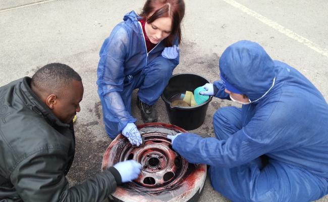 People working on a wheel